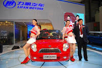 Models with a new Lifan 320 car at the Shanghai auto show